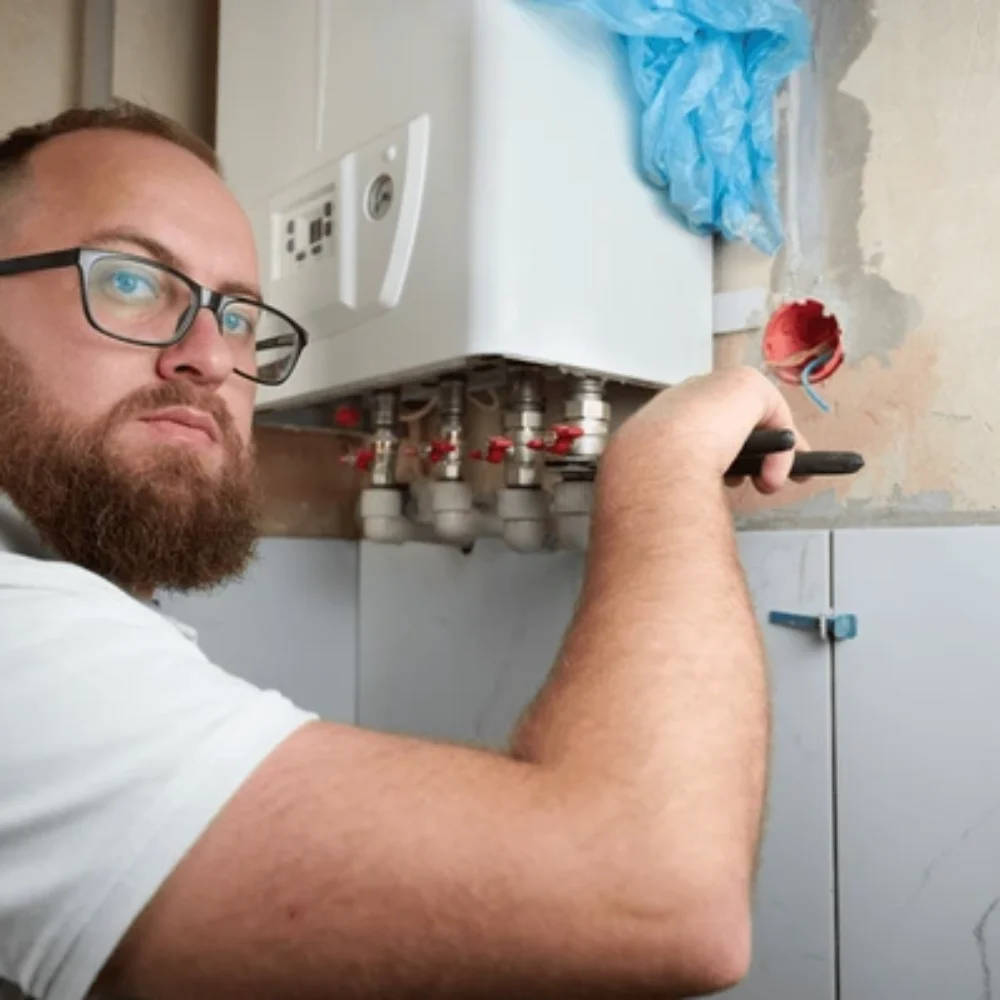 plumber-install-boiler-professional-engineer-600nw-2559497891